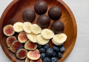 chocolate in wooden bowl with fruit